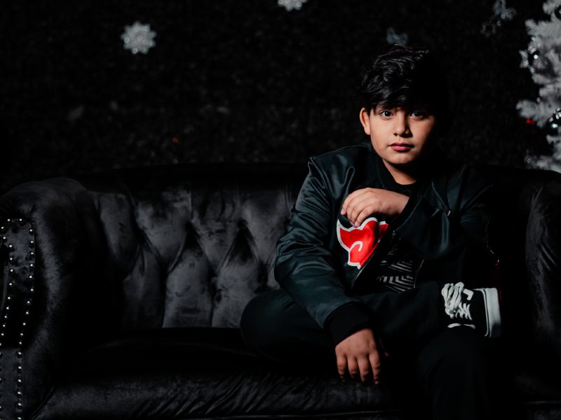Studio youth portrait — velvet sofa dark backdrop